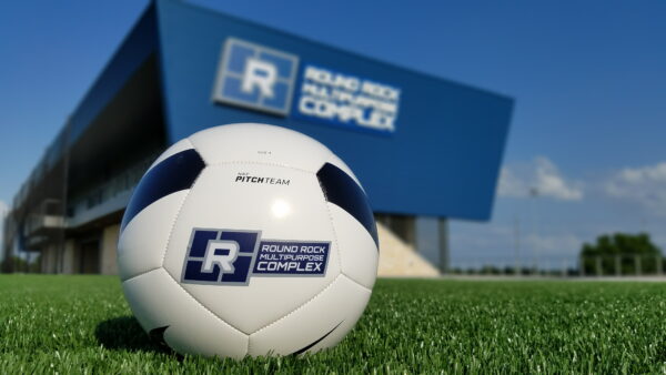 soccer ball in on grass front of Round Rock Multipurpose Complex-policies page