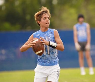athlete throwing football