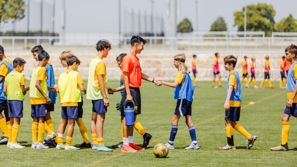 Athletes shaking hands after a soccer scrimmage at the Round Rock Multipurpose Complex